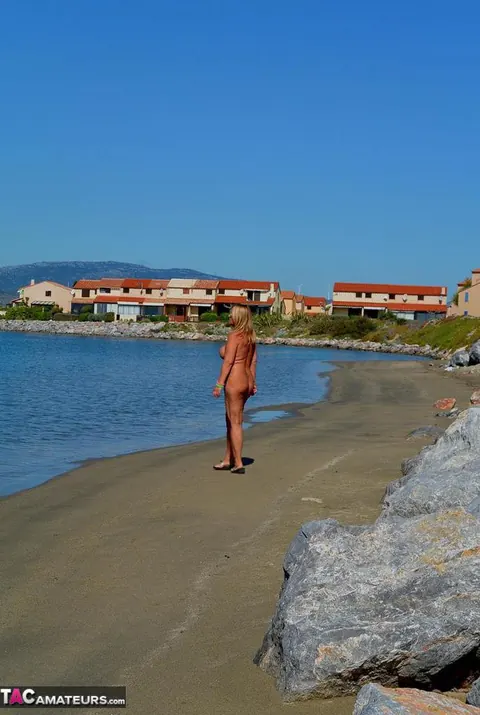 Nudechrissy: European Blonde Flaunts Her Huge Tits on the Beach – photo 20 of 20