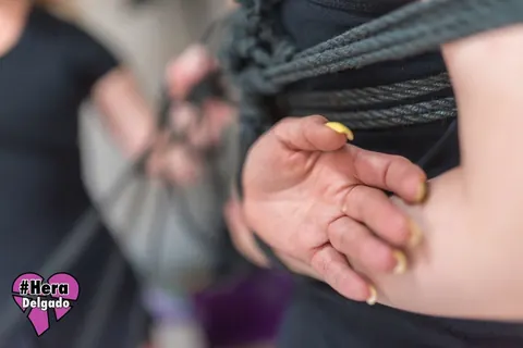 Pigtailed Woman Bound in Ropes Kisses Female Partner – photo 12 of 16