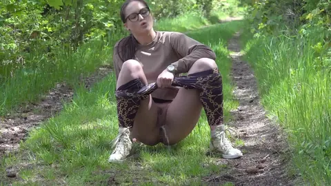 European in Glasses Lowers Yoga Pants to Pee on the Forest Path – photo 10 of 15