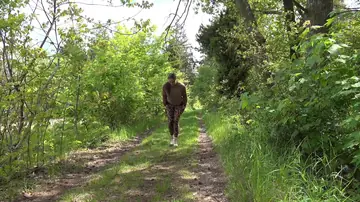 European in Glasses Lowers Yoga Pants to Pee on the Forest Path