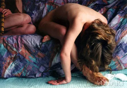Woman Undresses and Poses Nude Arching Her Back – photo 11 of 21