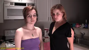 Redhead and Her Lover Play with a Dildo in the Kitchen