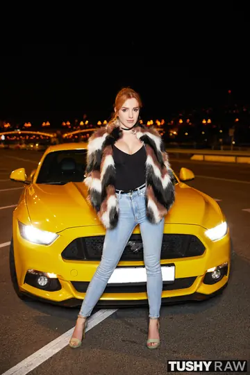 Busty Redhead Takes Anal and a Butt Plug in the Car