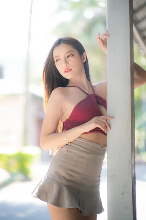 Busty Asian Brunette Shows Her Legs in a Miniskirt and Heels Outdoors – photo 14 of 20