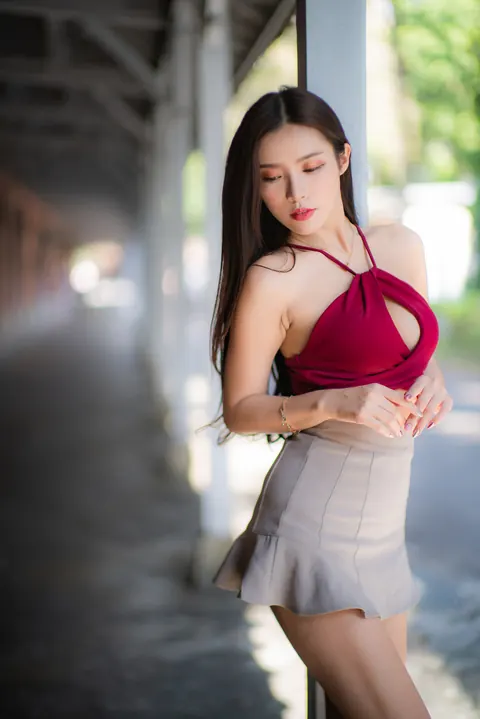 Busty Asian Brunette Shows Her Legs in a Miniskirt and Heels Outdoors – photo 18 of 20