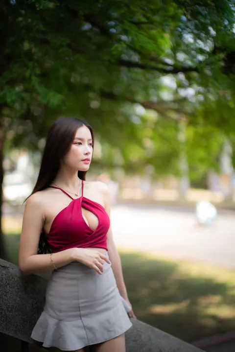 Busty Asian Brunette Shows Her Legs in a Miniskirt and Heels Outdoors – photo 9 of 20