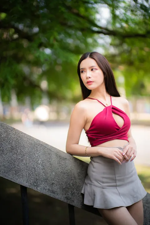 Busty Asian Brunette Shows Her Legs in a Miniskirt and Heels Outdoors – photo 8 of 20