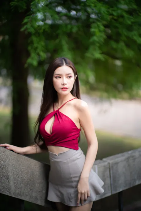 Busty Asian Brunette Shows Her Legs in a Miniskirt and Heels Outdoors – photo 6 of 20