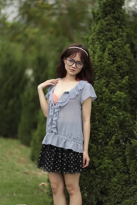 Skinny Asian Brunette Poses in a Skirt Outdoors – photo 14 of 20
