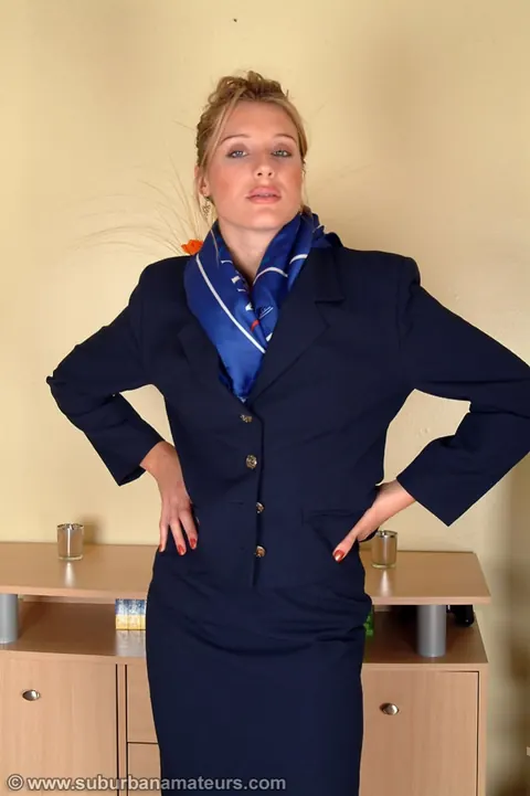 Tall British MILF Strips Off Her Uniform and Shows Her Hairy Bush – photo 1 of 20