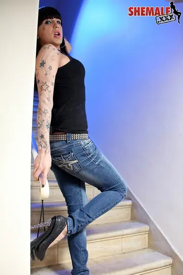 Trans Woman Poses in Jeans Outdoors