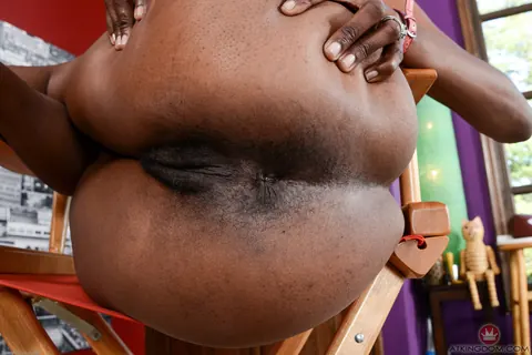 Ebony Woman in Panties Spreads Her Trimmed Pussy on the Chair – photo 7 of 16