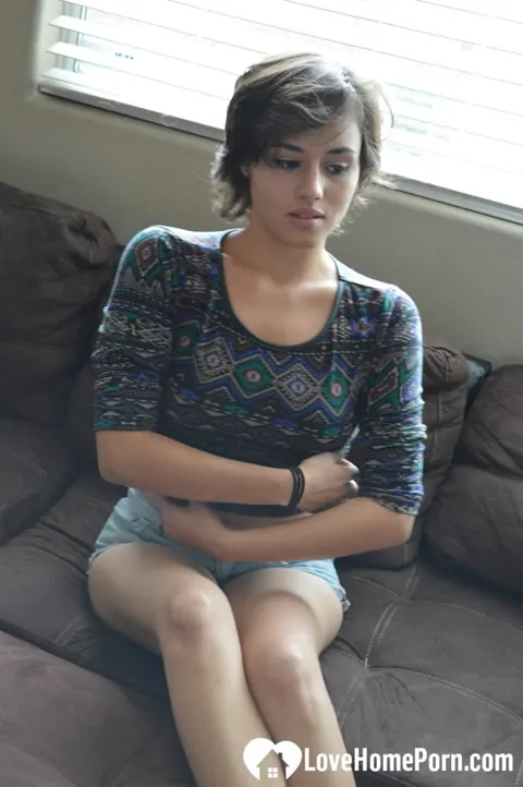 Short-Haired Skinny Brunette Babe Masturbates with a Dildo on the Sofa – photo 4 of 20