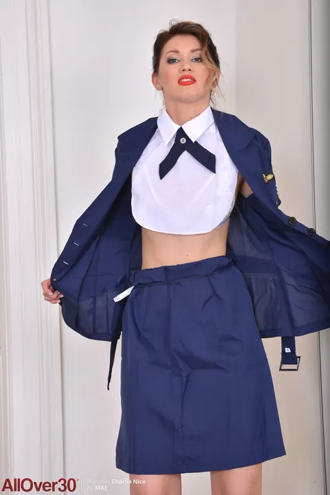 Charlie Nice: Mature Brunette Strips Off Her Stewardess Uniform and Lingerie – photo 8 of 21