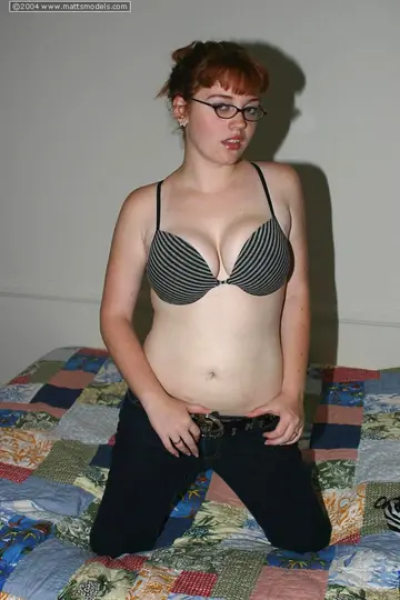 Busty Redhead in Glasses Shows Off Her Natural Tits and Curves