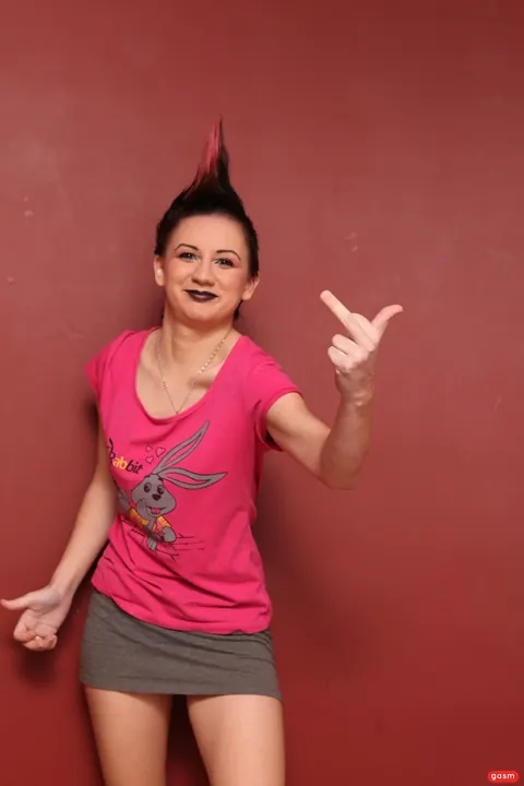 European Woman with Short Hair Poses Fully Clothed – photo 2 of 15