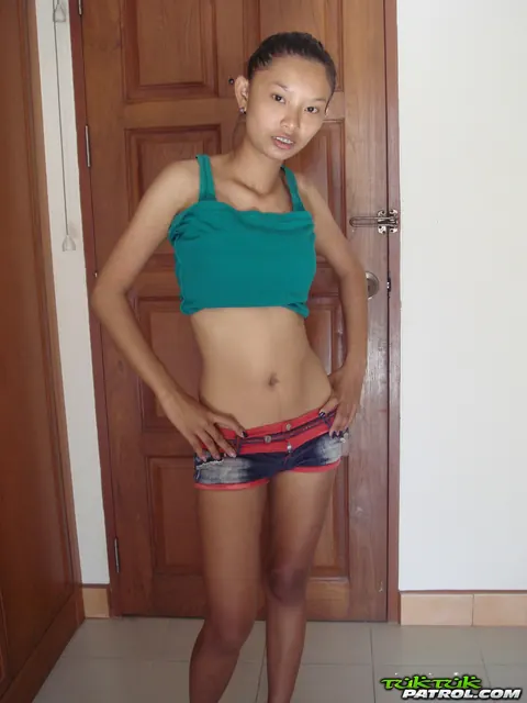 Petite Thai in Shorts Strips and Shows Her Shaved Pussy – photo 7 of 21