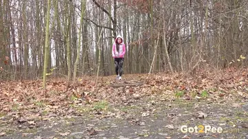 Slim European Brunette Spreads Her Hairy Pussy and Pisses Outdoors