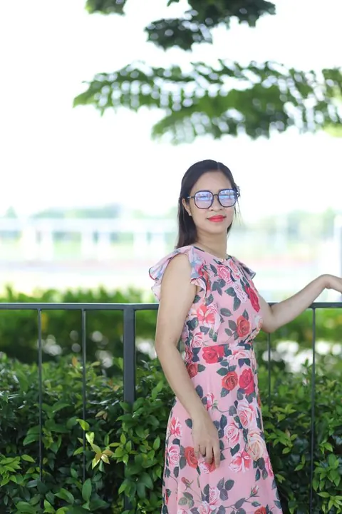 Asian Brunette in a Skirt and Glasses Poses Outdoors – photo 15 of 21