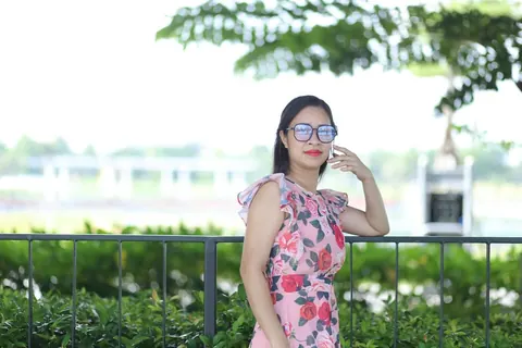 Asian Brunette in a Skirt and Glasses Poses Outdoors – photo 14 of 21