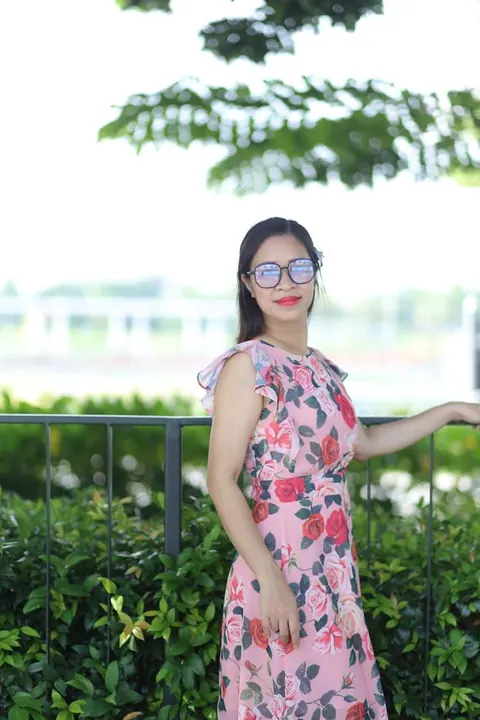 Asian Brunette in a Skirt and Glasses Poses Outdoors – photo 16 of 21