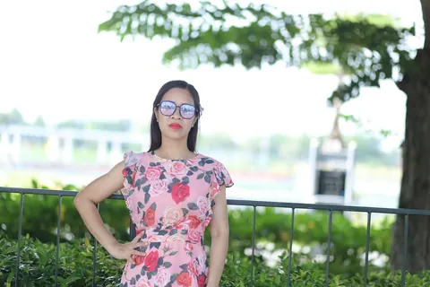 Asian Brunette in a Skirt and Glasses Poses Outdoors – photo 20 of 21