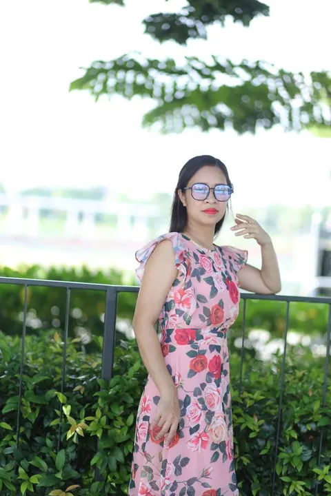 Asian Brunette in a Skirt and Glasses Poses Outdoors – photo 11 of 21