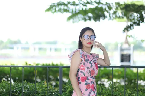 Asian Brunette in a Skirt and Glasses Poses Outdoors – photo 13 of 21