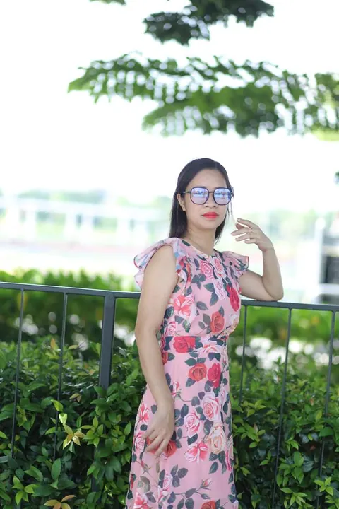 Asian Brunette in a Skirt and Glasses Poses Outdoors – photo 12 of 21