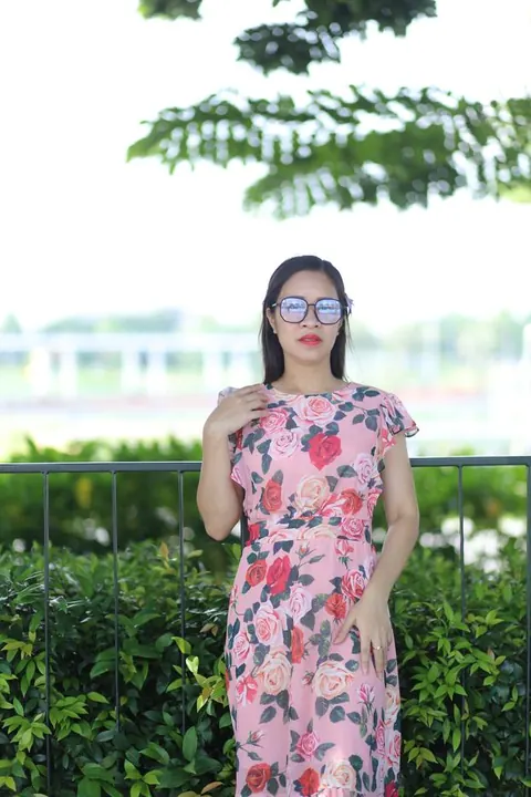 Asian Brunette in a Skirt and Glasses Poses Outdoors – photo 17 of 21