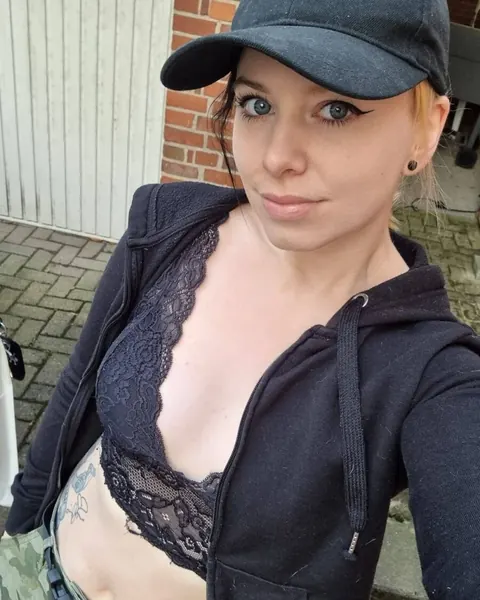 Blonde in a Bikini and Glasses Takes Selfies Outdoors – photo 1 of 13