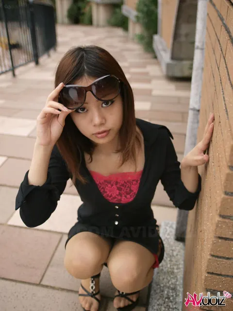 Japanese Brunette Lifts Her Glasses to Show Her Face Outdoors – photo 11 of 15
