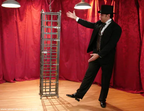Soolin Kelter: Slim Korean MILF in a Skirt Bound and Caged During a Magic Show – photo 18 of 20