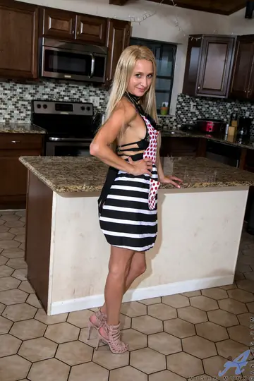 Mature Blonde Rubs a Vibrator on Her Pussy in the Kitchen
