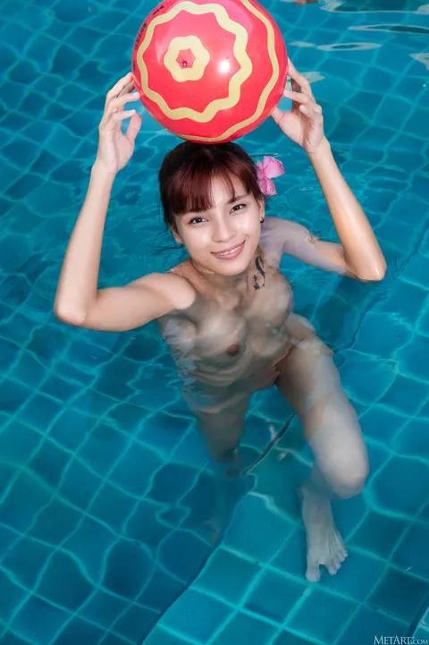 Asian Woman Strips Out of Her Bikini and Oils Up by the Pool – photo 21 of 21