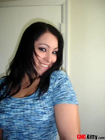 Asian Brunette Goes Topless and Spreads Her Pussy