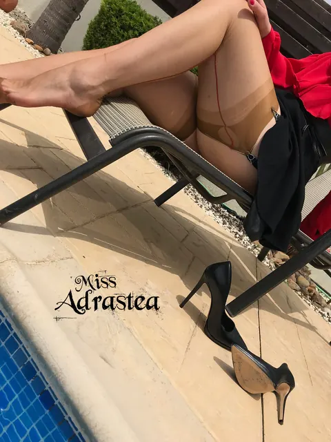 Miss Adrastea: German MILF in a Skirt and Stockings Flaunts Her Feet Poolside – photo 14 of 15