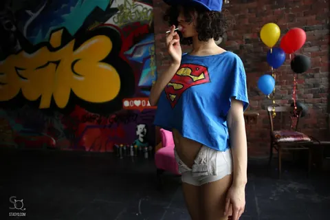 Curly Brunette Shows Off Her Big Natural Tits in Shorts – photo 15 of 21