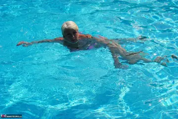 Blonde MILF Swims in a Bikini and Glasses Then Flashes Her Tits
