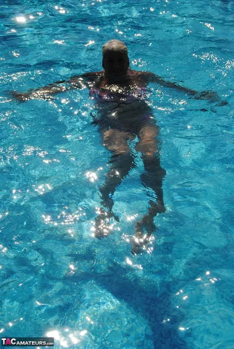 Blonde MILF Swims in a Bikini and Glasses Then Flashes Her Tits – photo 12 of 20
