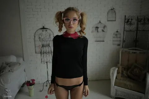 Slim Blonde in Pigtails and Glasses Poses in Panties – photo 8 of 20