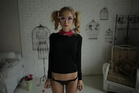 Slim Blonde in Pigtails and Glasses Poses in Panties – photo 2 of 20