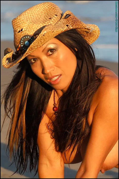 Rossie Cottrell: Asian Brunette Bares Her Big Enhanced Tits on the Beach – photo 11 of 15