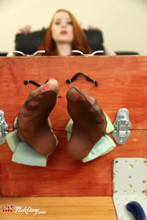 Sha Rizel: Busty Redhead in Stocks Removes Her Heels and Spreads Her Legs – photo 10 of 12