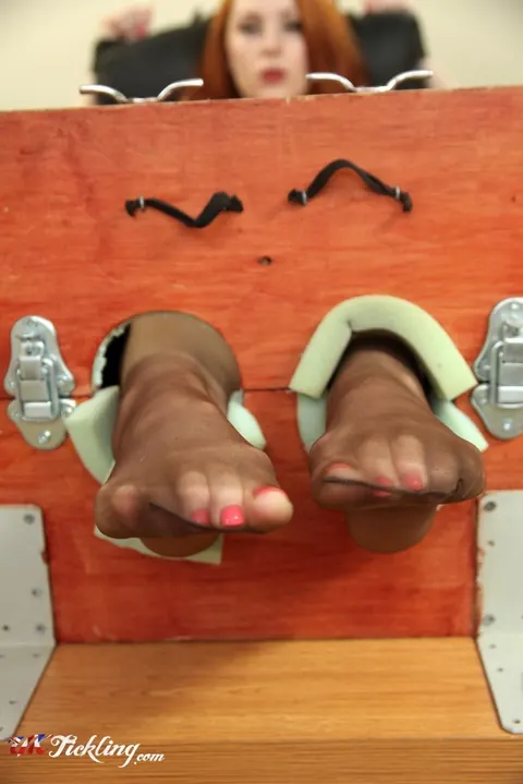 Sha Rizel: Busty Redhead in Stocks Removes Her Heels and Spreads Her Legs – photo 11 of 12