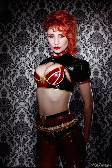 British Redhead MILF Strips Out of Latex and Boots