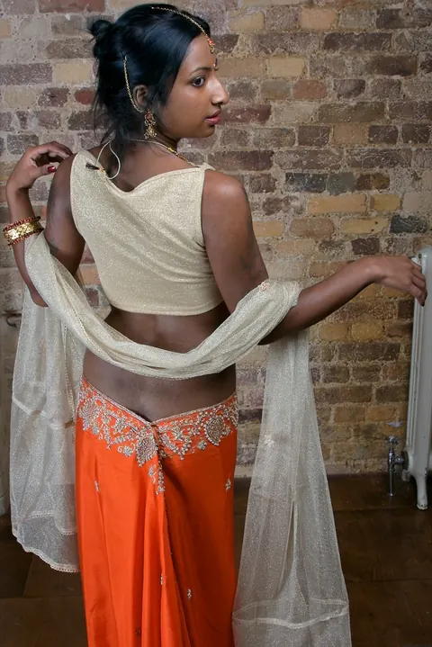 Indian Brunette with Tattoos Reveals Her Body in a Skirt – photo 4 of 15