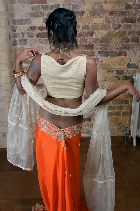 Indian Brunette with Tattoos Reveals Her Body in a Skirt – photo 5 of 15