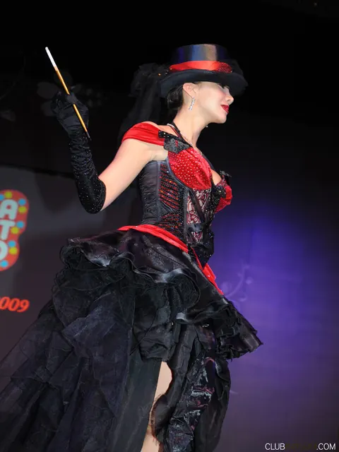Katsuni: Busty Asian MILF Poses in a Skirt at a Convention – photo 5 of 15