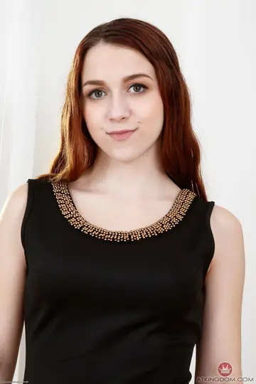 Petite Redhead Lies Back and Spreads Her Legs Wide